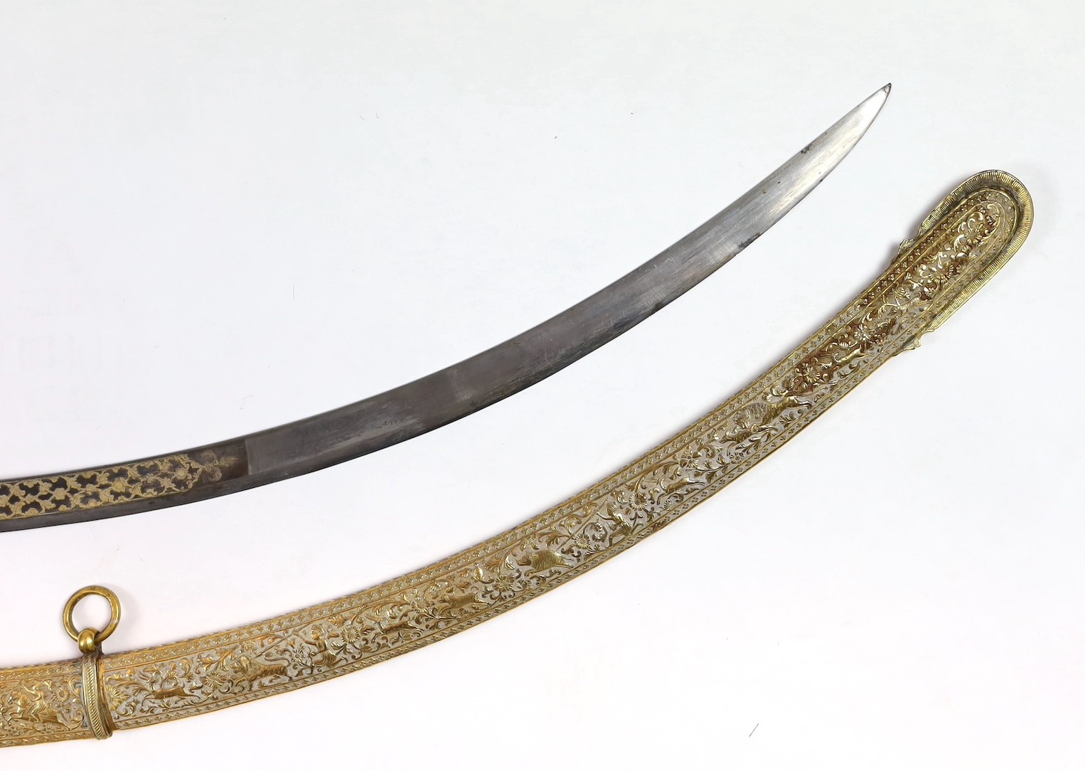 A fine Indian gilt copper and paste mounted sword (shamshir), Kutch, 19th century, sword 79cm long, scabbard 75cm long